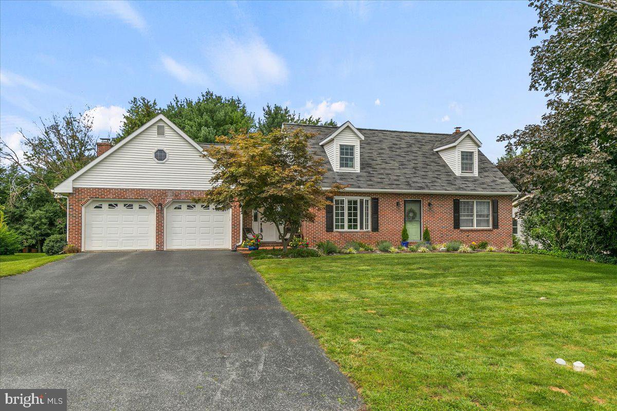 44 Green Acre Road Lititz, PA 17543 - Photo 66 of 66 a front view of a house with a garden and trees