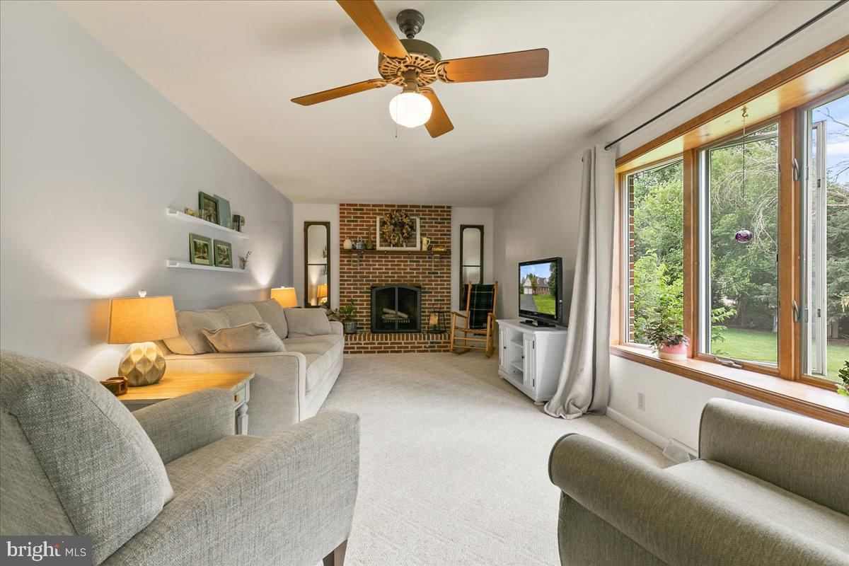 44 Green Acre Road Lititz, PA 17543 - Photo 8 of 66 a living room with furniture large window and a fireplace