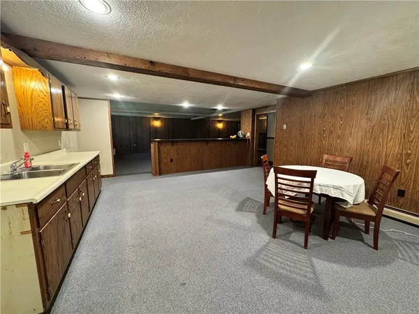 a lobby with furniture and a mirror