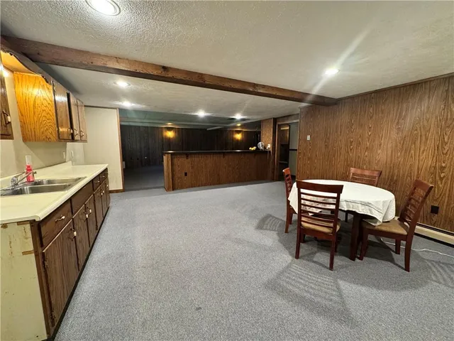 a lobby with furniture and a mirror