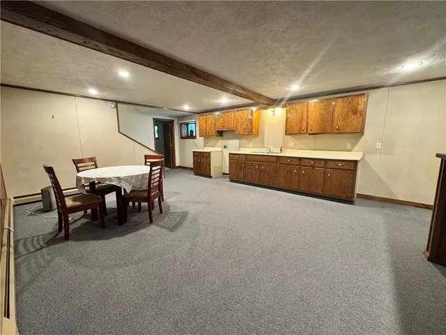 a large hall with dining table and chairs