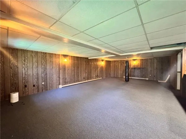 a view of a room with wooden walls