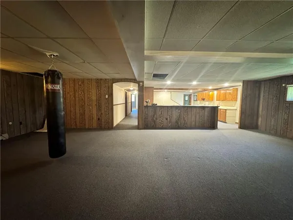 a kitchen with furniture and a sink