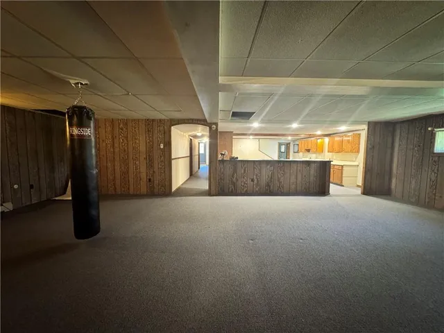 a kitchen with furniture and a sink