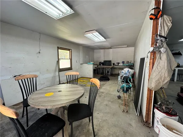 a room with gym equipment and windows