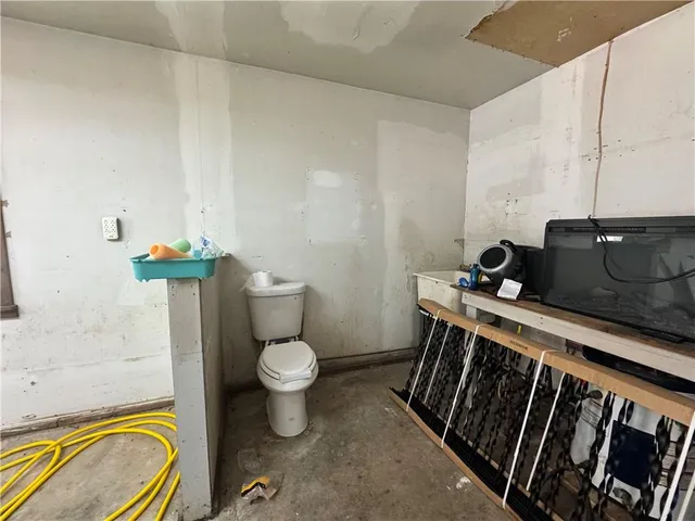 a view of a field with a tree in the background