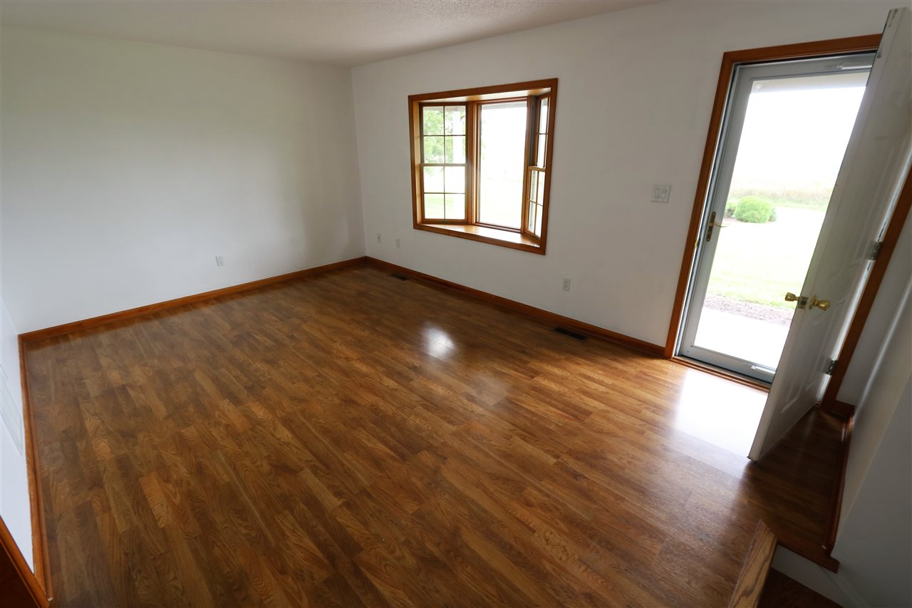 1067 Madrid Road Waynesboro, VA 22980 - Photo 11 of 48 a view of empty room with wooden floor and fan