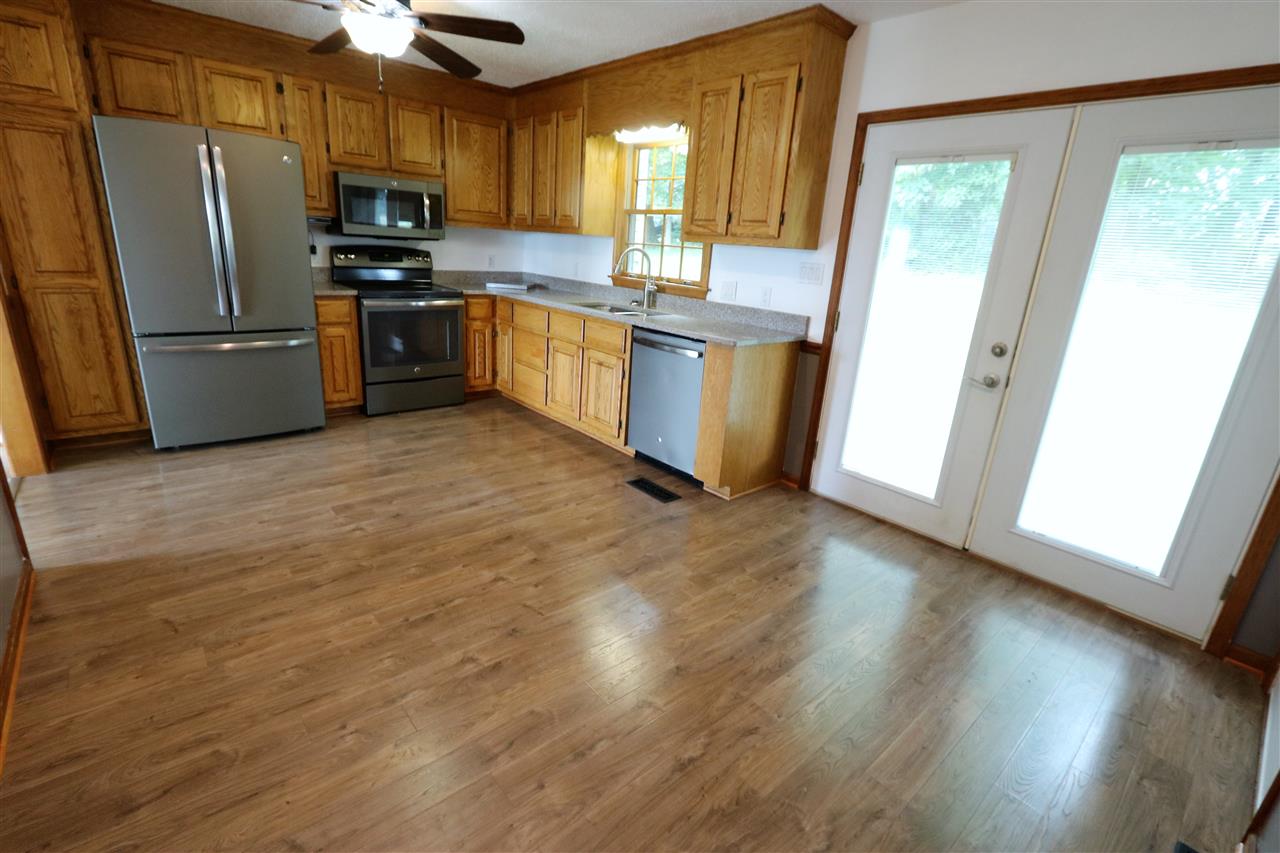 1067 Madrid Road Waynesboro, VA 22980 - Photo 16 of 48 a kitchen with stainless steel appliances granite countertop a refrigerator microwave and sink