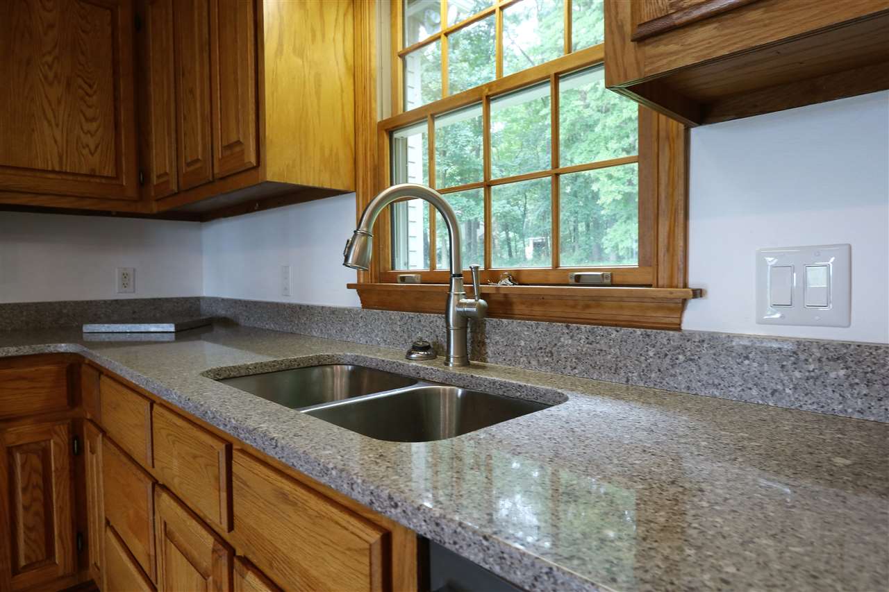 1067 Madrid Road Waynesboro, VA 22980 - Photo 17 of 48 a kitchen with granite countertop a sink and a window