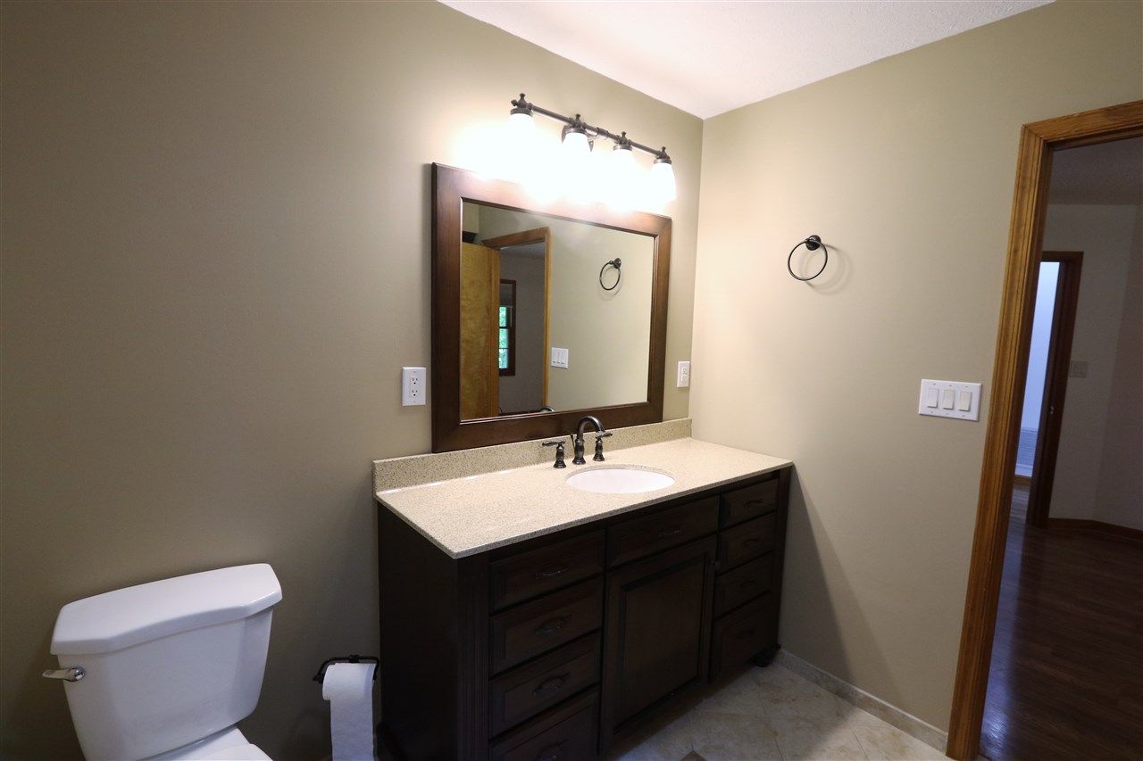1067 Madrid Road Waynesboro, VA 22980 - Photo 27 of 48 a bathroom with a toilet sink and mirror