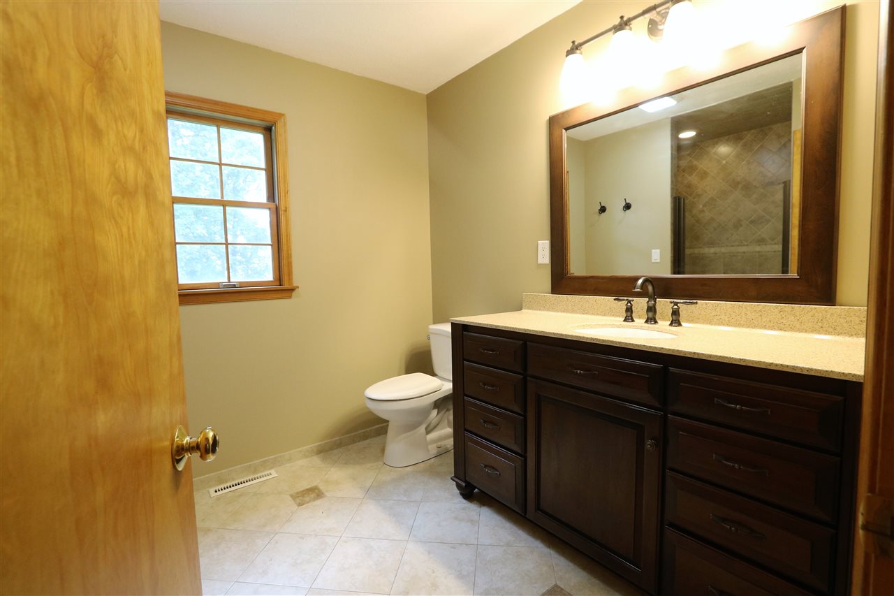 1067 Madrid Road Waynesboro, VA 22980 - Photo 31 of 48 a bathroom with a sink and a mirror
