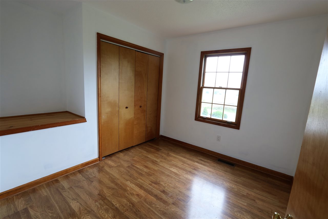1067 Madrid Road Waynesboro, VA 22980 - Photo 34 of 48 an empty room with wooden floor and windows