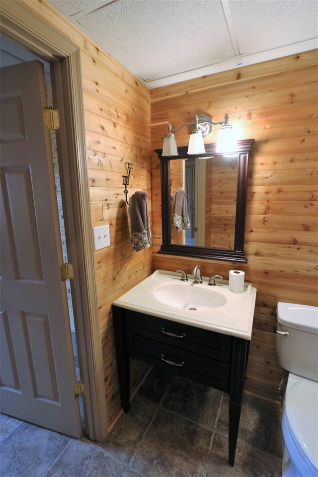 1067 Madrid Road Waynesboro, VA 22980 - Photo 39 of 48 a view of a bathroom with a sink and a mirror