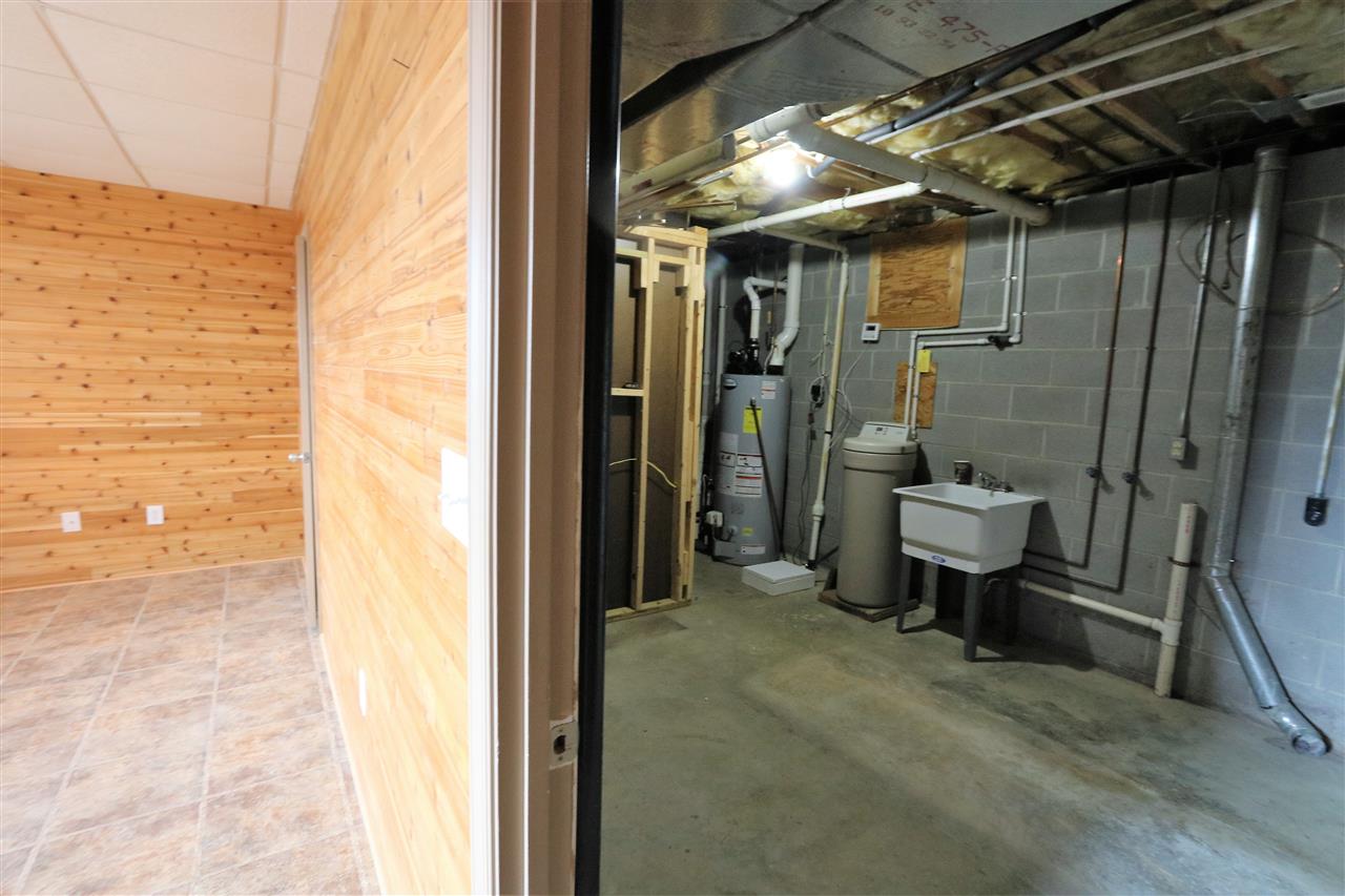 1067 Madrid Road Waynesboro, VA 22980 - Photo 43 of 48 a view of a bathroom with a tub and shower