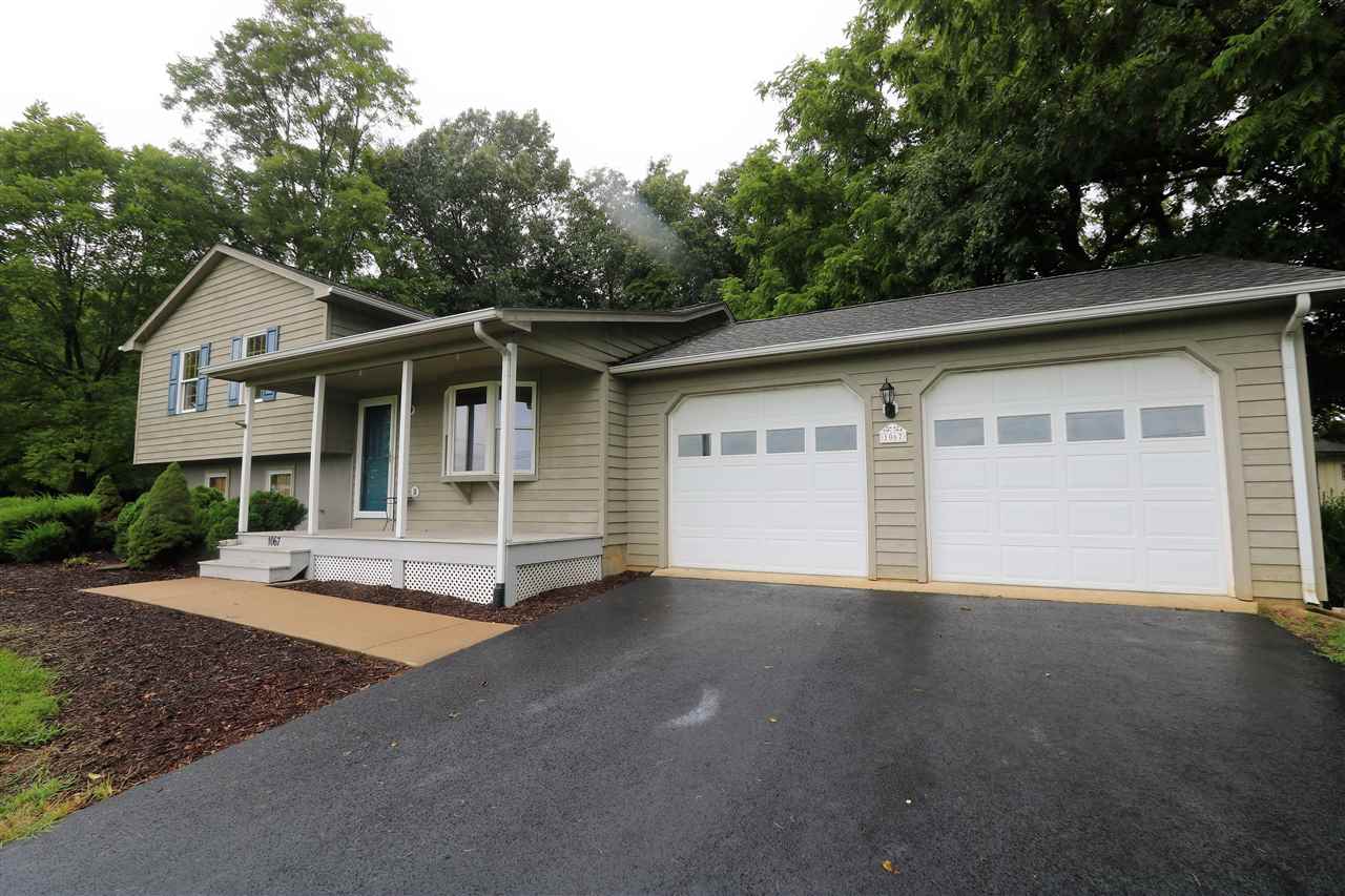 1067 Madrid Road Waynesboro, VA 22980 - Photo 7 of 48 a front view of a house with a garden