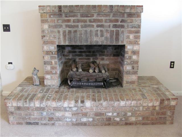 68 Pinegar Road Manchester, TN 37355 - Photo 5 of 15 The brick, gas log fireplace with raised hearth is the perfect focal point of this relaxing room.