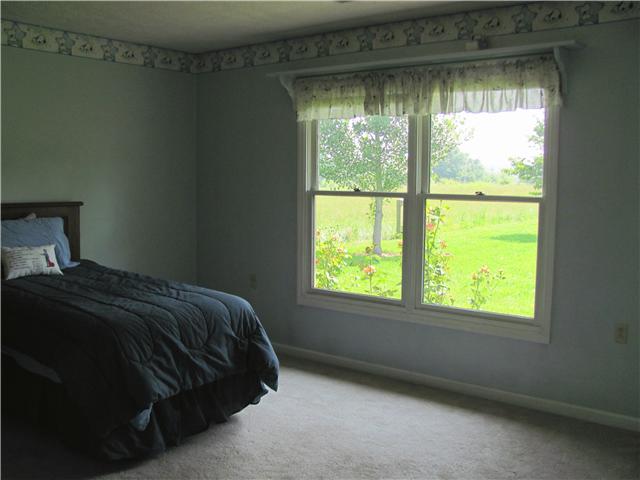 68 Pinegar Road Manchester, TN 37355 - Photo 9 of 15 Bedroom 2 is large with carpet, double windows and a nice shelf above.