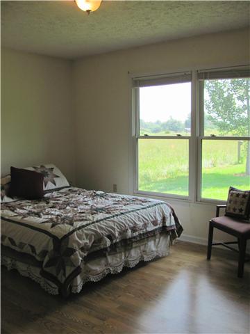 68 Pinegar Road Manchester, TN 37355 - Photo 10 of 15 Bedroom 3 has laminate flooring and large double windows.