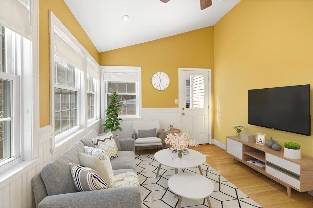 10 Bowker Street Lexington, MA 02421 - Photo 11 of 24 a living room with furniture and a flat screen tv