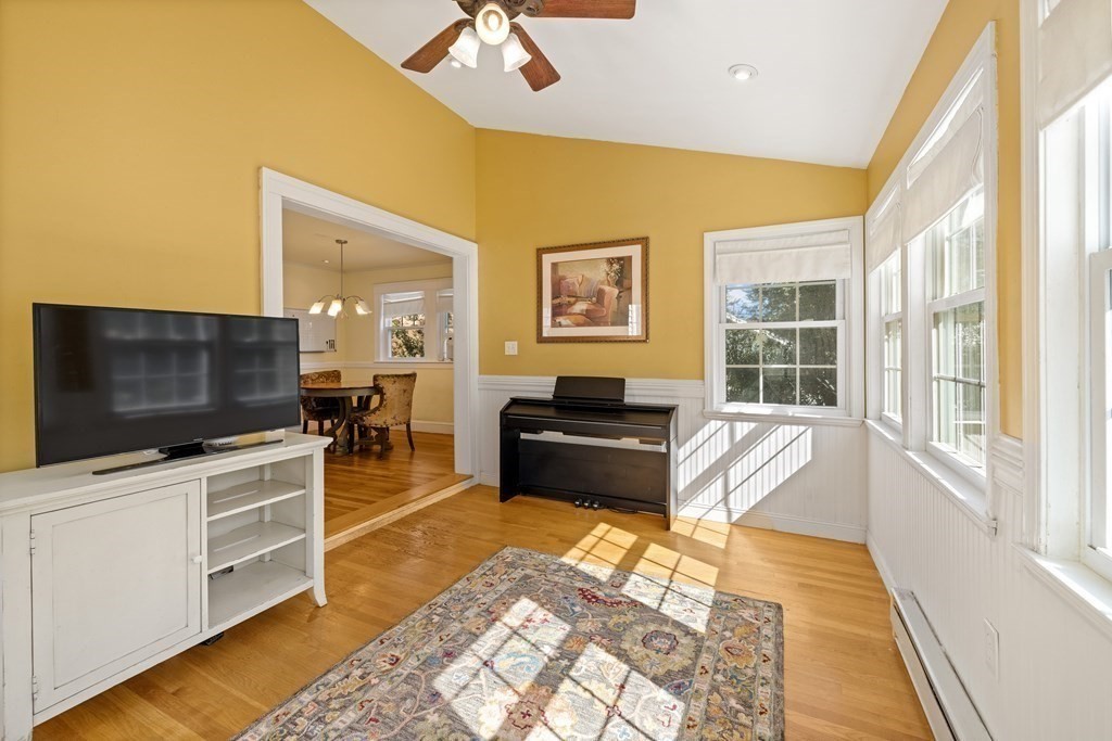 10 Bowker Street Lexington, MA 02421 - Photo 12 of 24 a living room with furniture and a flat screen tv