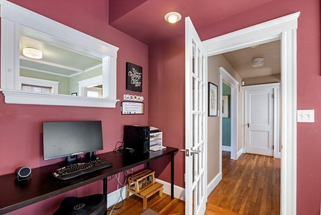 10 Bowker Street Lexington, MA 02421 - Photo 14 of 24 a room with furniture and a wooden floor