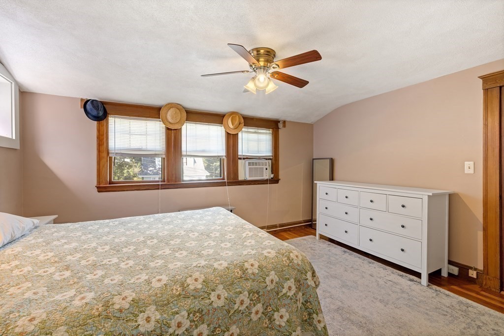 10 Bowker Street Lexington, MA 02421 - Photo 16 of 24 a bedroom with a bed dresser and a window