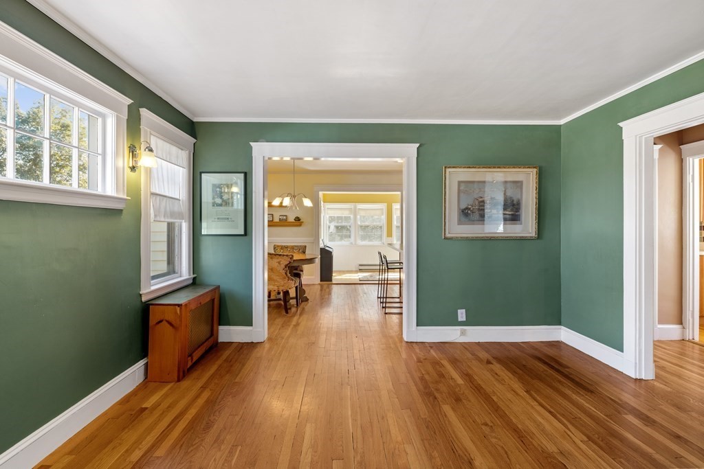 10 Bowker Street Lexington, MA 02421 - Photo 5 of 24 a view of empty room with wooden floor and fan