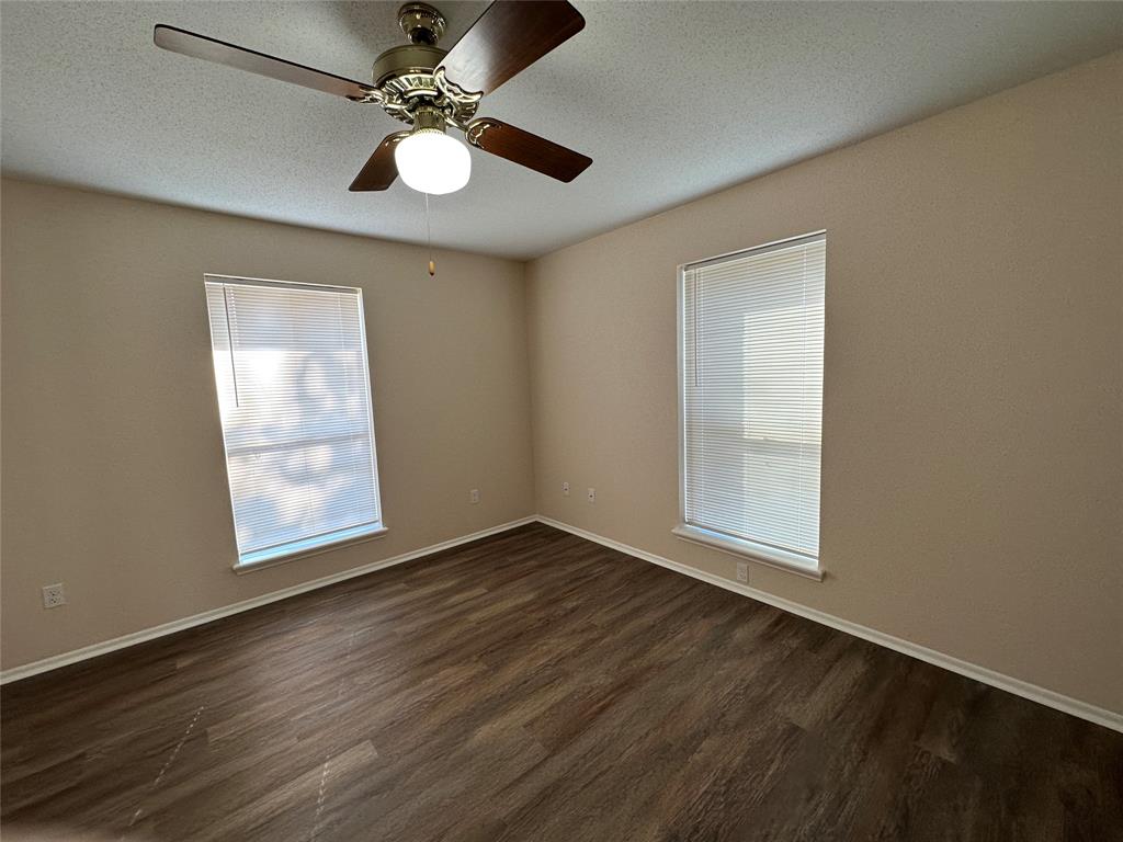 1047 Pr 3022 Elgin Elgin, TX 78621 - Photo 8 of 21 The split-bedroom layout places the primary suite on one side of the home, with two additional bedrooms on the opposite end for added privacy.