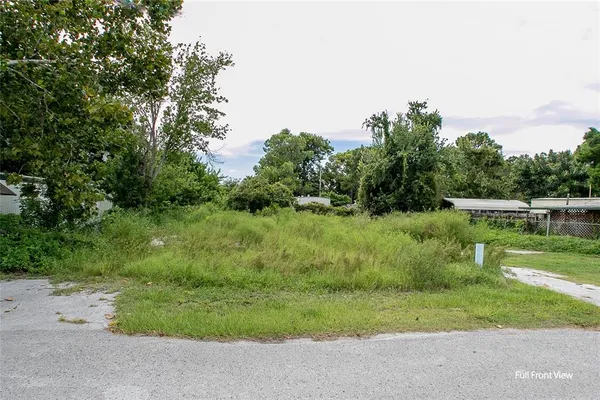 a view of backyard with outdoor seating and green space