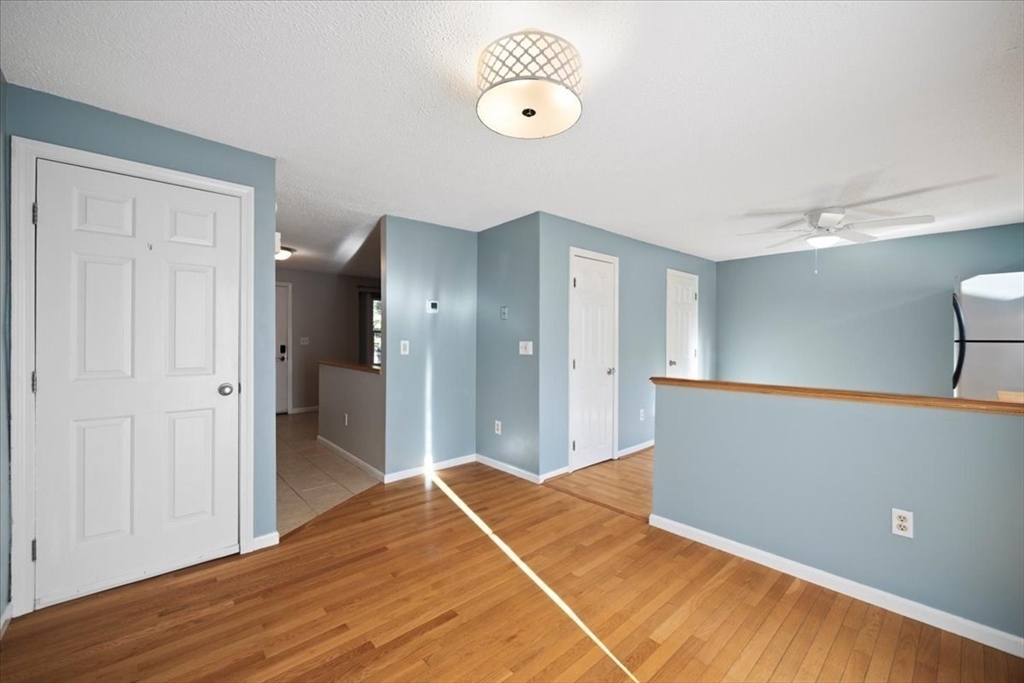 6 Robin Circle, Unit 1 Norton, MA 02766 - Photo 11 of 38 a view of a room with wooden floor