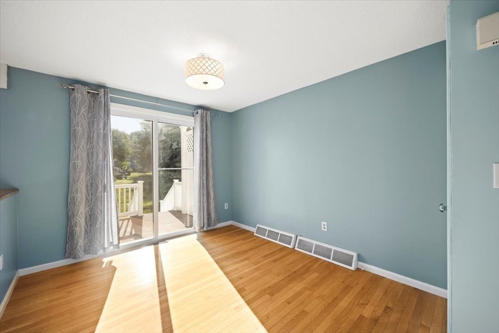6 Robin Circle, Unit 1 Norton, MA 02766 - Photo 12 of 38 a view of a room with wooden floor