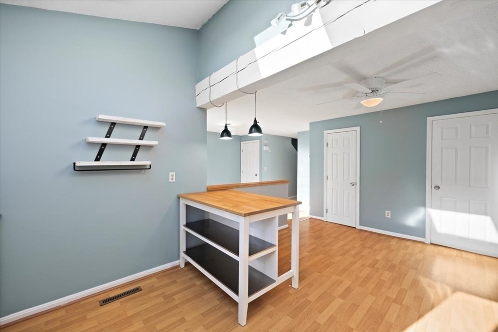 6 Robin Circle, Unit 1 Norton, MA 02766 - Photo 18 of 38 a room with wooden floor and window