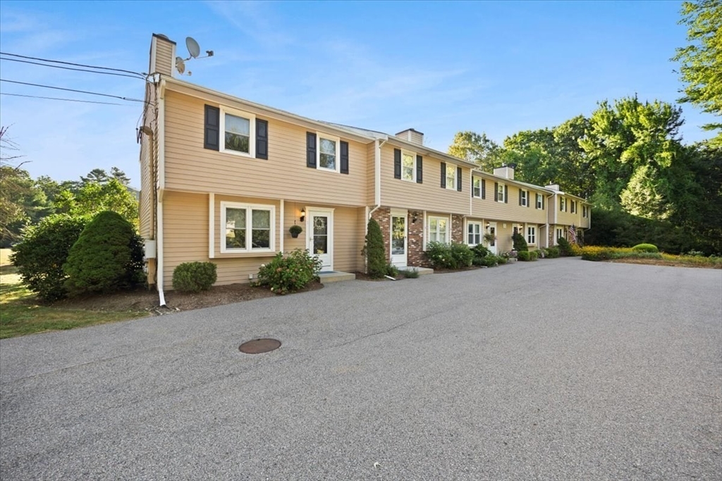 6 Robin Circle, Unit 1 Norton, MA 02766 - Photo 2 of 38 front view of a house with a street