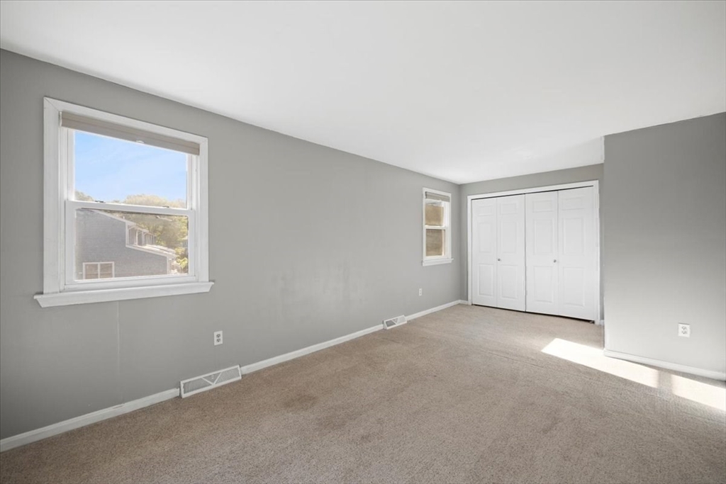 6 Robin Circle, Unit 1 Norton, MA 02766 - Photo 28 of 38 an empty room with windows and closet