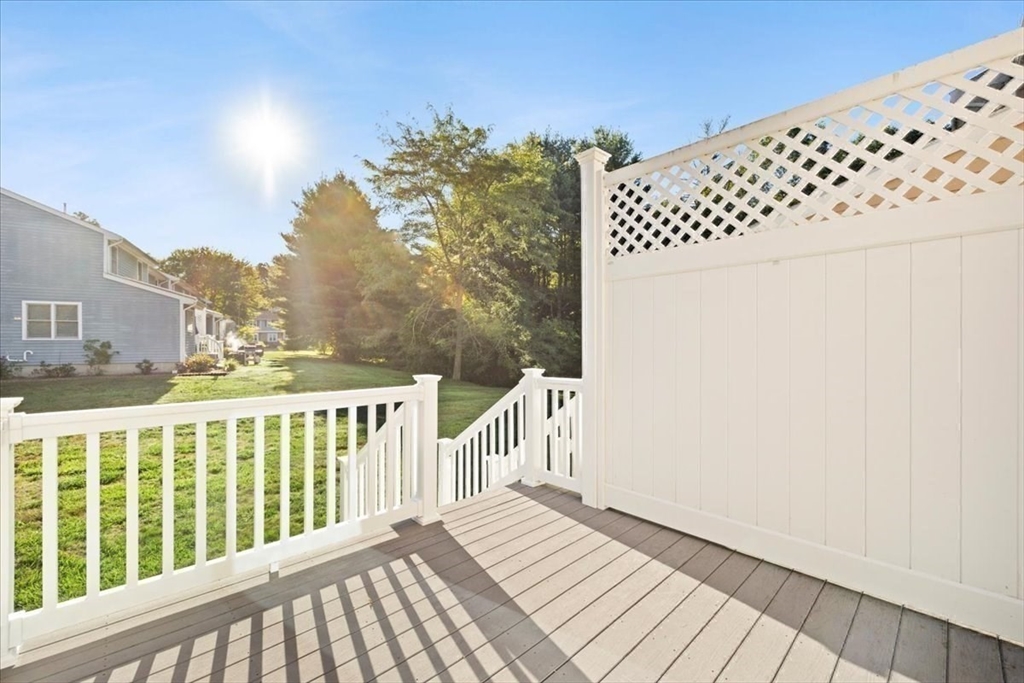 6 Robin Circle, Unit 1 Norton, MA 02766 - Photo 36 of 38 a view of a balcony with wooden floor