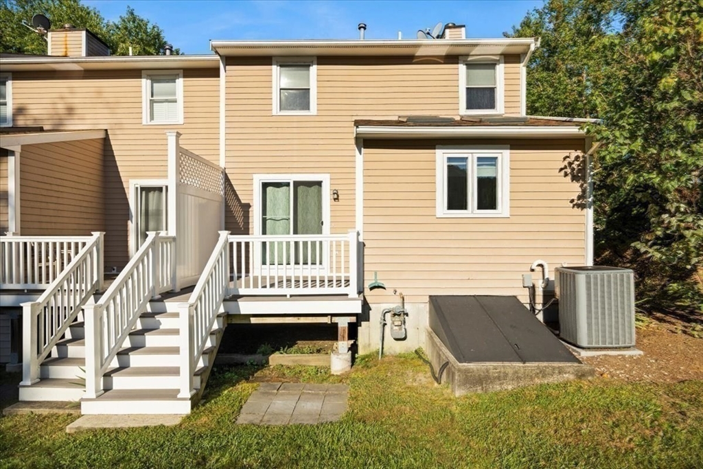6 Robin Circle, Unit 1 Norton, MA 02766 - Photo 37 of 38 a view of a house with a patio and a yard