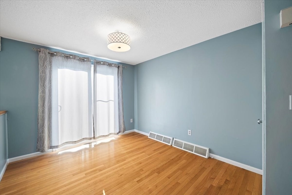6 Robin Circle, Unit 1 Norton, MA 02766 - Photo 9 of 38 a view of an empty room with a window