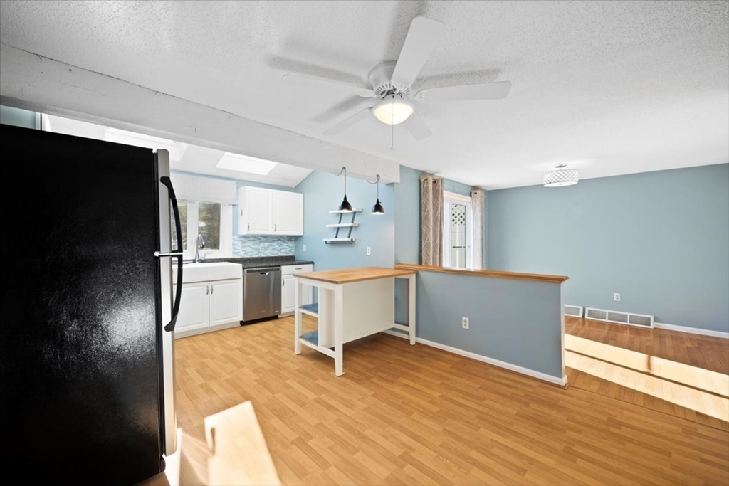6 Robin Circle, Unit 1 Norton, MA 02766 - Photo 10 of 38 a kitchen with a refrigerator and a sink