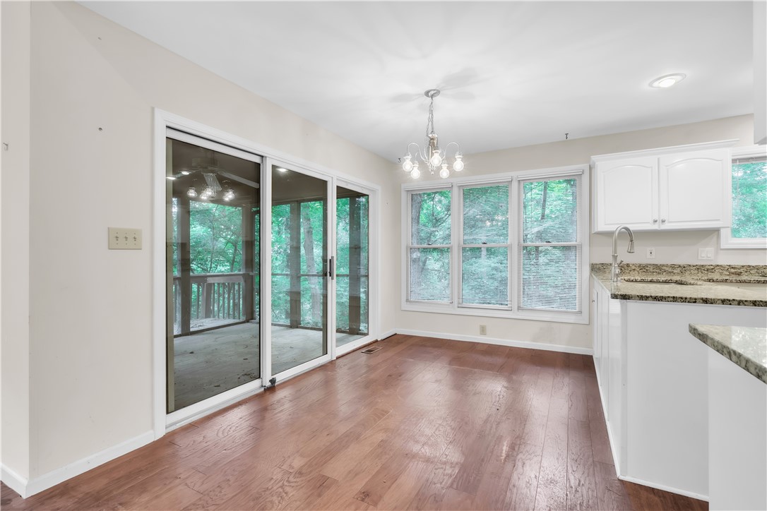 149 Inlet Pointe Drive Anderson, SC 29625 - Photo 8 of 43 Hardwood floors and ample natural light define this welcoming breakfast area, with a view of the outdoors.