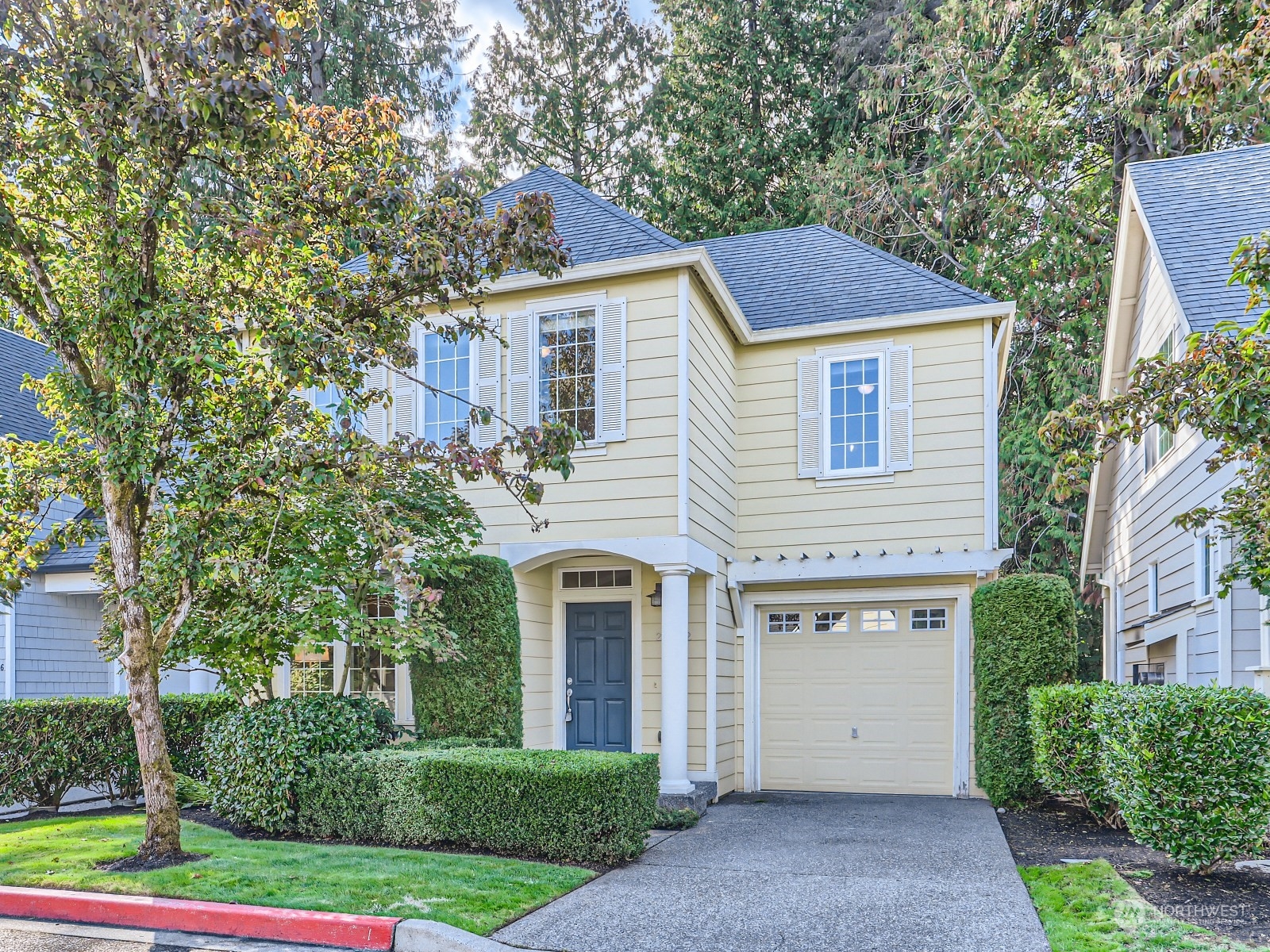 23922 33rd Drive Southeast, Unit 8 Bothell, WA 98021 - Photo 1 of 28 front view of a house with a yard