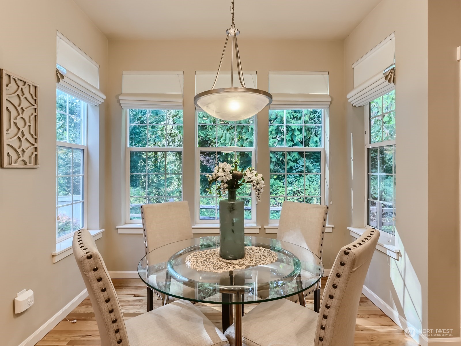23922 33rd Drive Southeast, Unit 8 Bothell, WA 98021 - Photo 13 of 28 a dining room with furniture wooden floor and a chandelier