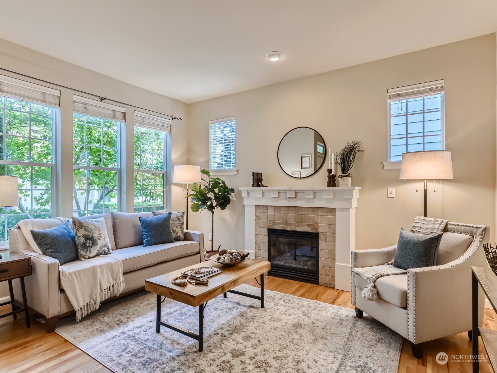 23922 33rd Drive Southeast, Unit 8 Bothell, WA 98021 - Photo 5 of 28 a living room with furniture and a fireplace