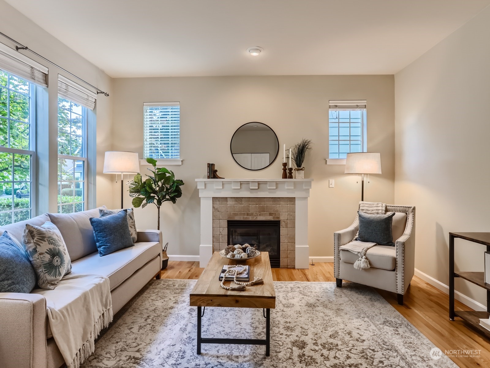 23922 33rd Drive Southeast, Unit 8 Bothell, WA 98021 - Photo 6 of 28 a living room with furniture and a fireplace