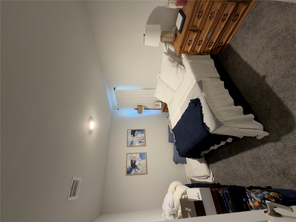 132 Small Seed Buda, TX 78610 - Photo 14 of 18 a bedroom with a bed and a lamp