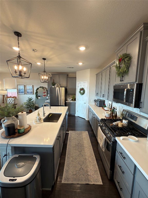 132 Small Seed Buda, TX 78610 - Photo 8 of 18 a large kitchen with a stove a refrigerator a sink a dining table and chairs