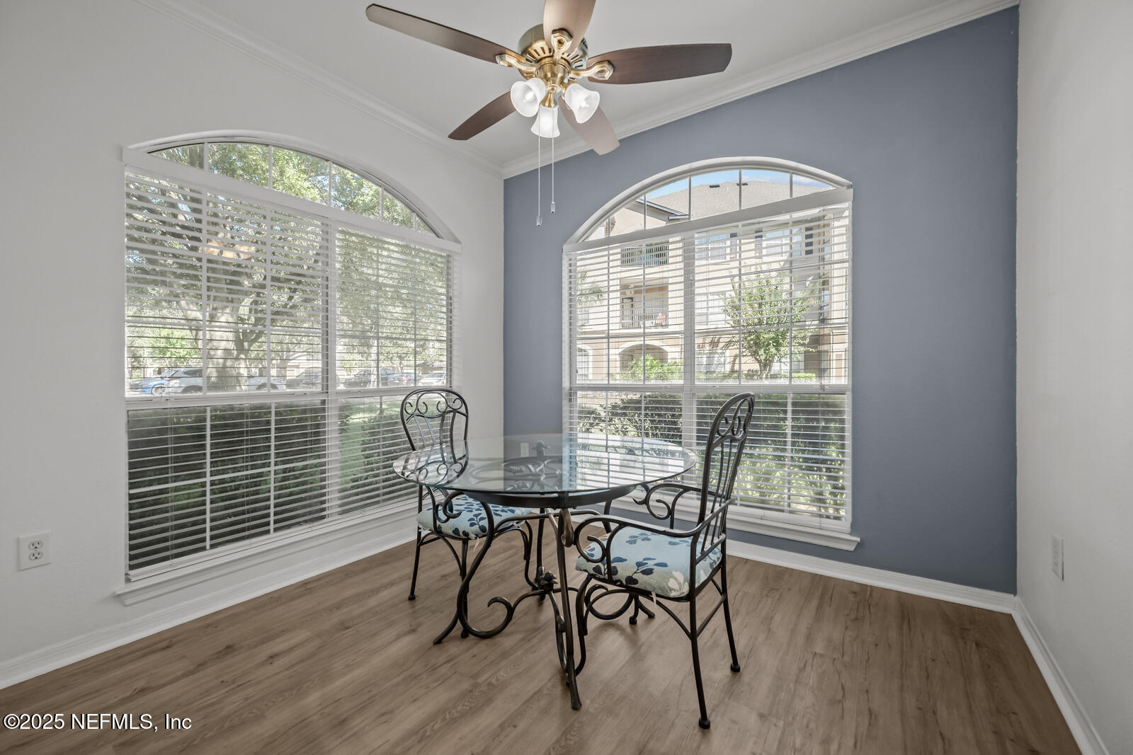 10961 Burnt Mill Road, Unit 1217 Jacksonville, FL 32256 - Photo 11 of 59 a view of a dining room with furniture window and wooden floor