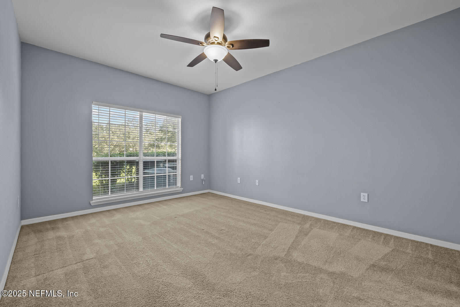 10961 Burnt Mill Road, Unit 1217 Jacksonville, FL 32256 - Photo 13 of 59 a view of an empty room with a window
