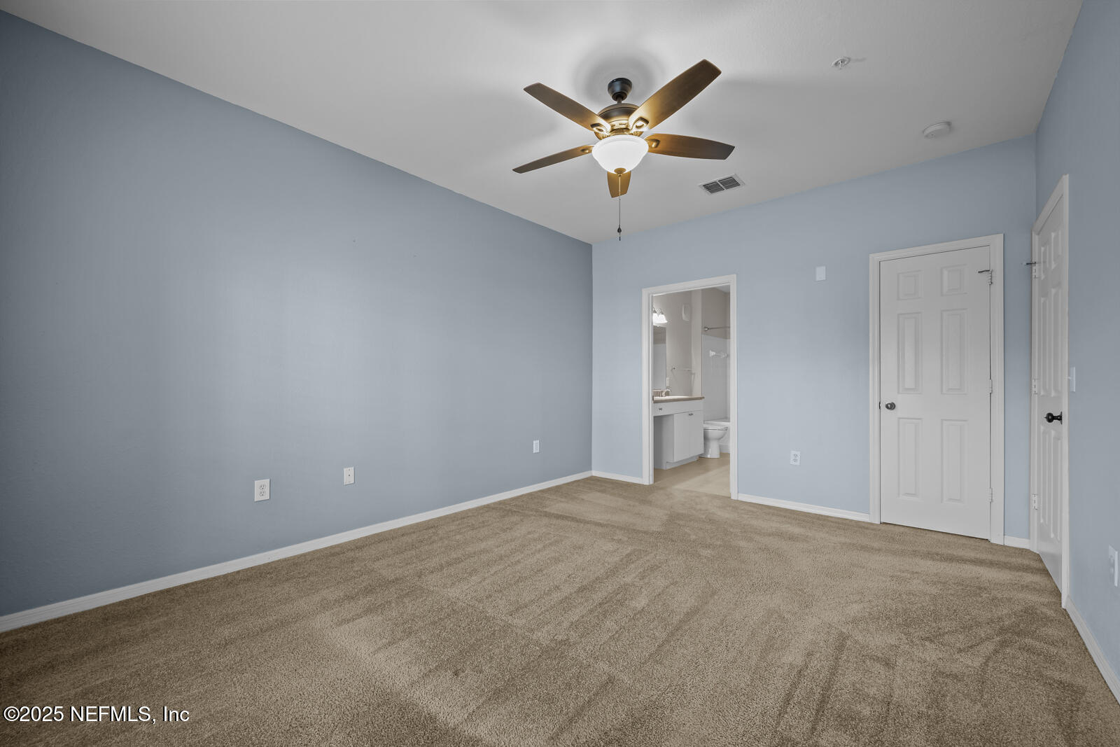 10961 Burnt Mill Road, Unit 1217 Jacksonville, FL 32256 - Photo 16 of 59 a view of an empty room with a fan