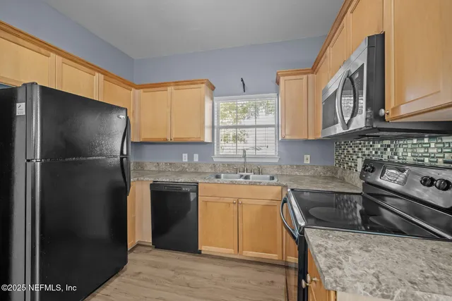 a bedroom with furniture and a chandelier
