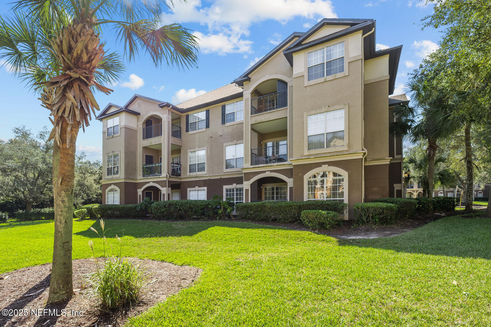 10961 Burnt Mill Road, Unit 1217 Jacksonville, FL 32256 - Photo 26 of 59 a front view of a house with garden and porch